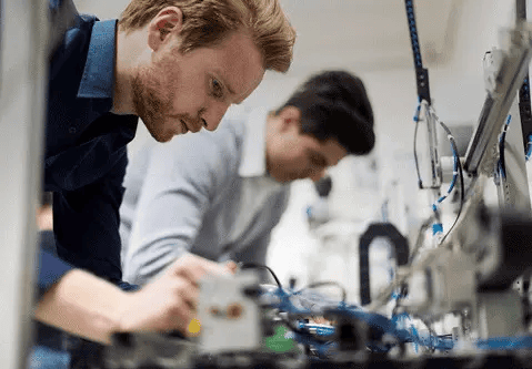 Two men working on electronic engineering
